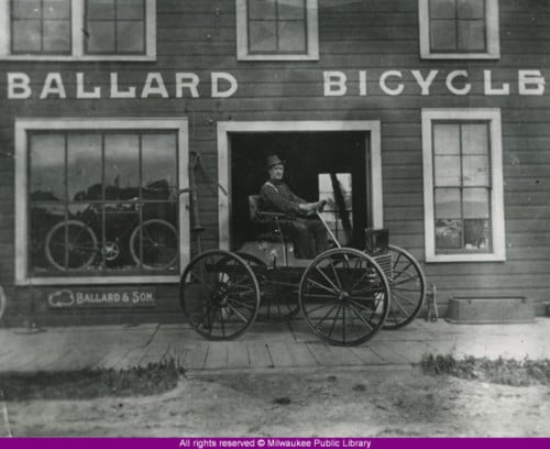Man on horseless carriage Ballard Bicycle Milwaukee Wisconsin