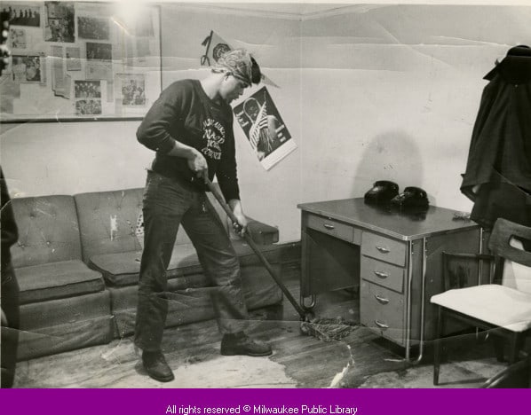 NAACP Youth Council member Forthune Humphrey Jr. mops room, Milwaukee, 1966.