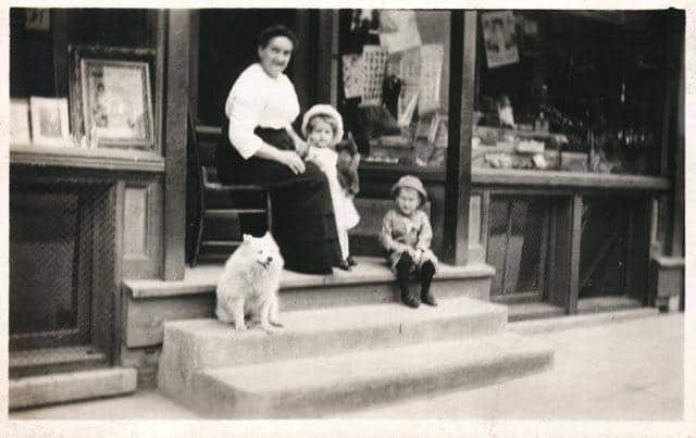 Roman Kwasniewski's mother and his children on the steps in front of his photography studio at 568 Lincoln Avenue, ca. 1915. University of Wisconsin-Milwaukee Libraries.