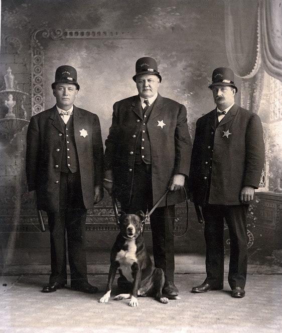 Three police officers with dog, Platteville, Wisconsin, ca. 1895.