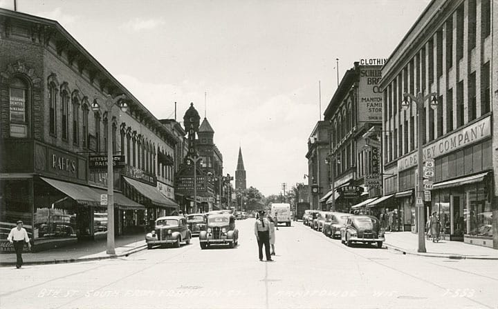 Schuette Brothers Department Store at 914 S. Eighth Street in Manitowoc closed its doors in 1994 after 145 years of business. This photo, looking south from the corner of S. 8th and Franklin streets, shows Woolworth’s on the left, J. C. Penney on the right, and Schuette’s in the distance on the right. The Schuette’s building stands empty today.  Manitowoc County Historical Society.