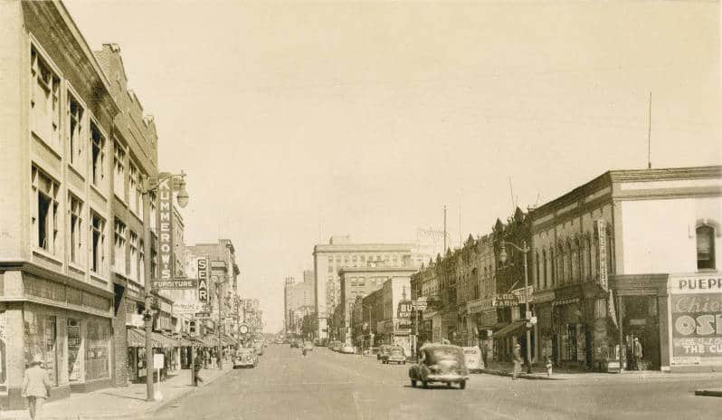 This view of Oshkosh's Main Street looking north in 1946 shows a bustling downtown shopping district, including Sears and Kline's Department Store. Oshkosh Public Library.
