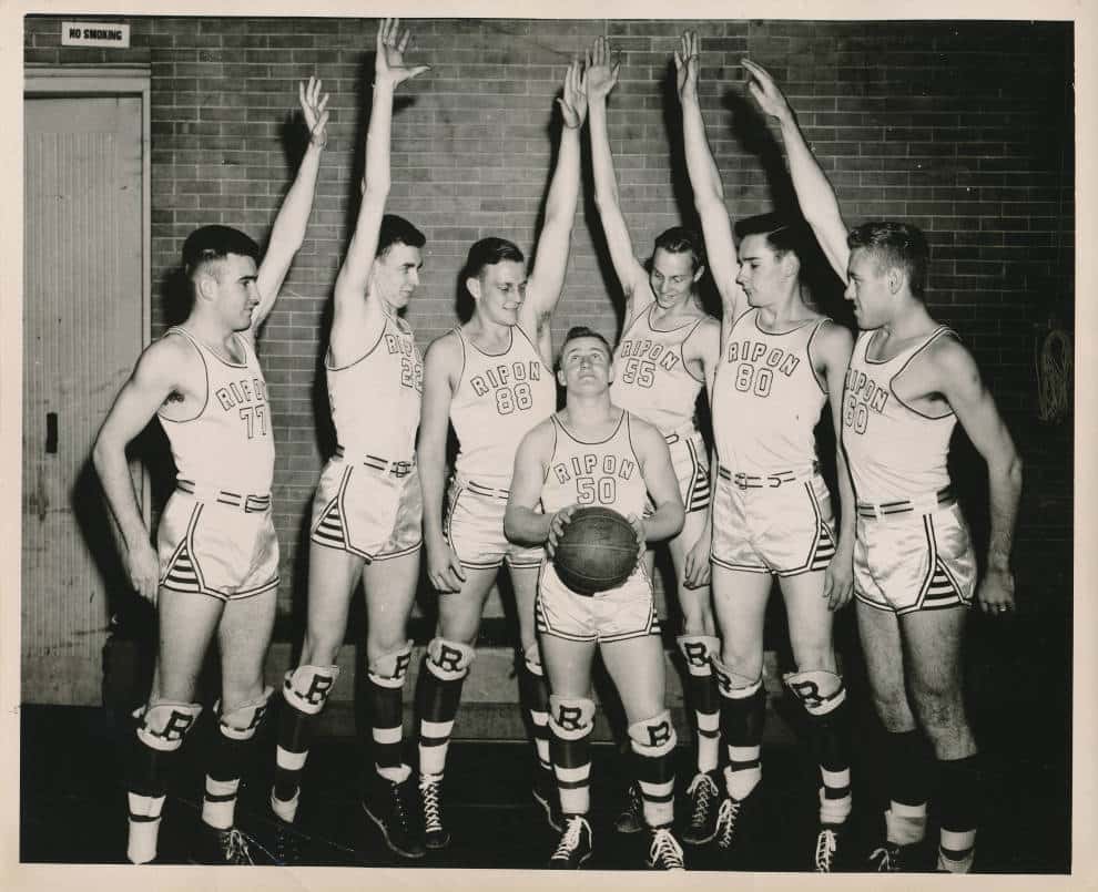 Don Stevens, center, surrounded by the taller members of the Ripon College basketball team, 1946. Ripon College Archives.