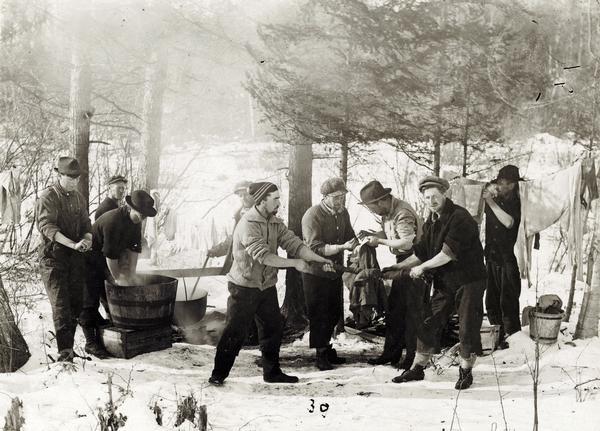 Sunday washing at Rice Lake Lumbering Camp #6, ca. 1913. Wisconsin Historical Images WHi-24425.