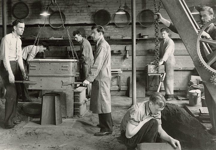 Students working in the molding room of the metals foundry, ca. 1930. University of Wisconsin-Stout.