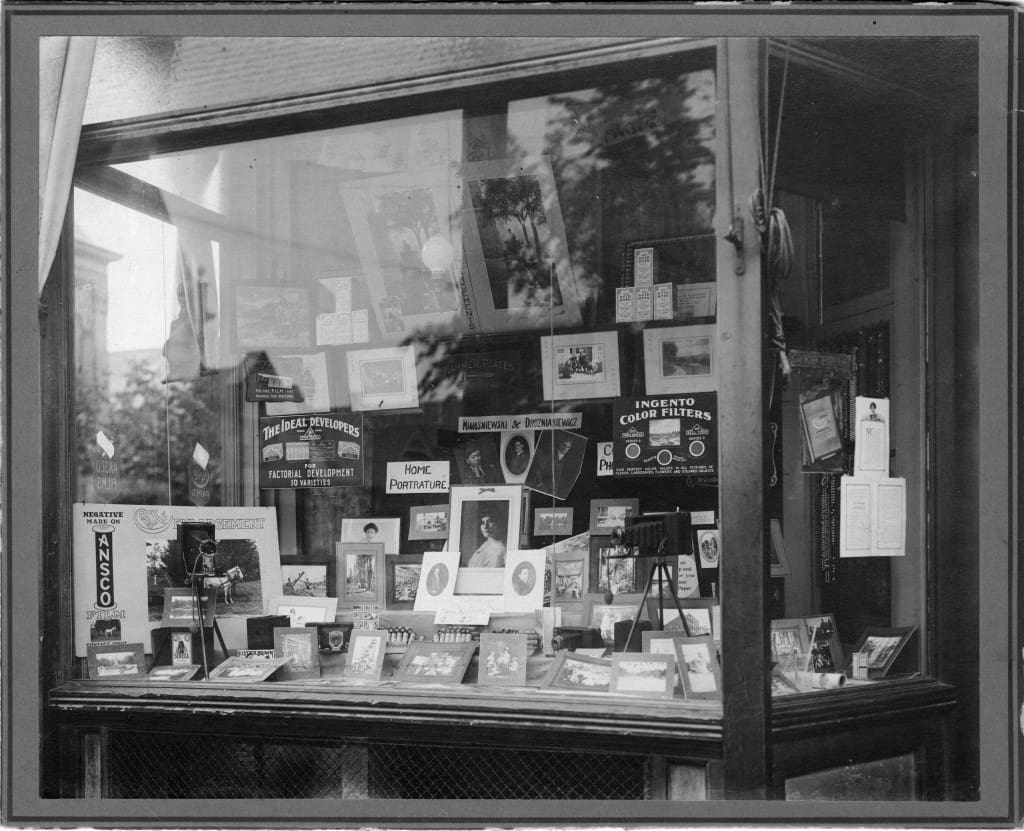 Display window at Kwasniewski's photography studio on Lincoln Avenue, Milwaukee. University of Wisconsin-Milwaukee Libraries.