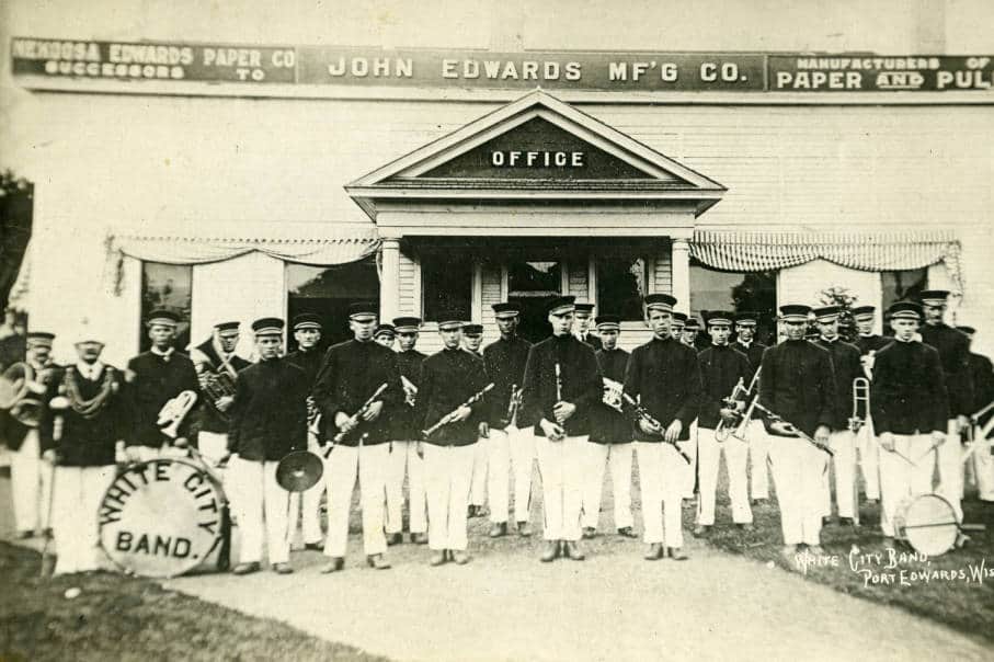 The White City Band posed in front of the main office of the Nekoosa Edwards Paper Company, Port Edwards, ca. 1910. South Wood County Historical Museum.