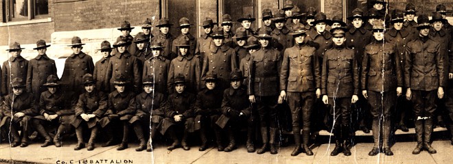 Members of the Students' Army Training Corps (S.A.T.C.) Battalion Company C pose for a group photo, probably on the day of their decommissioning, December 18, 1918. Marquette University Archives.