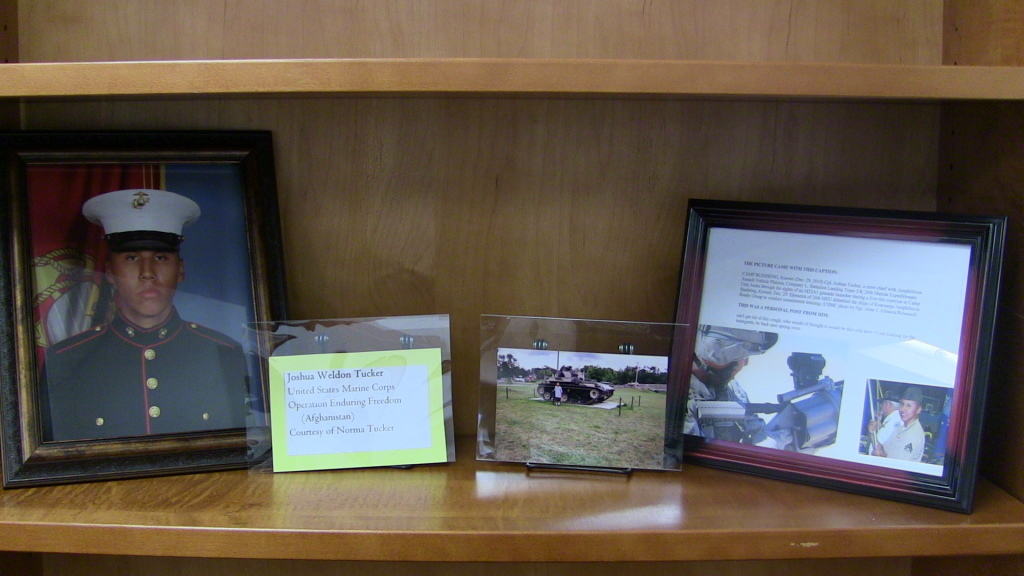 Photographs of Joshua Weldon Tucker on exhibit in the library. 