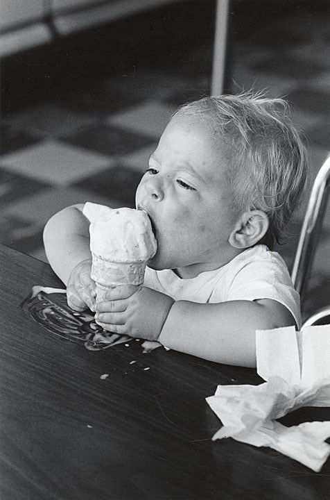 Jeremy Menchik digs into a Babcock Hall ice cream cone, 1981. UW-Madison Archives.