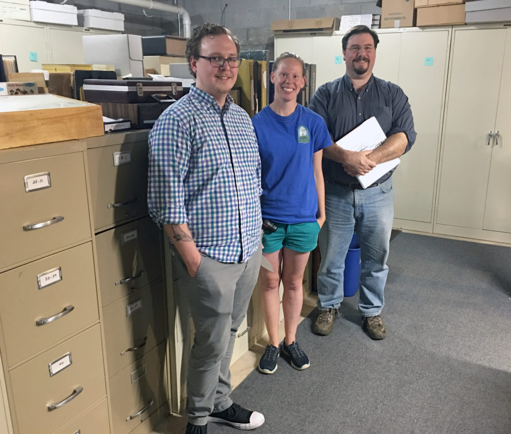 Cameron Fontaine, Amy Meyer and mentor Pete Shrake (Circus World Museum) in collections storage at the Manitowoc County Historical Society.