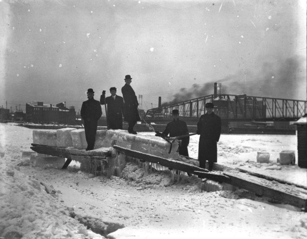 The frozen La Crosse waterfront with five men harvesting ice, ca. 1913. UW-La Crosse Murphy Library via University of Wisconsin Digital Collections Center.