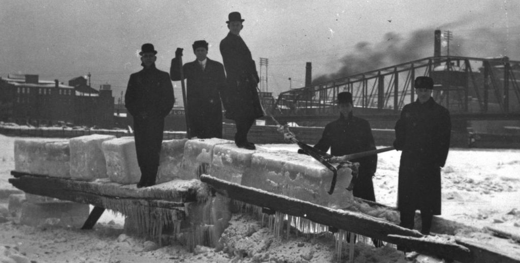 The frozen La Crosse waterfront with five men harvesting ice, ca. 1913.