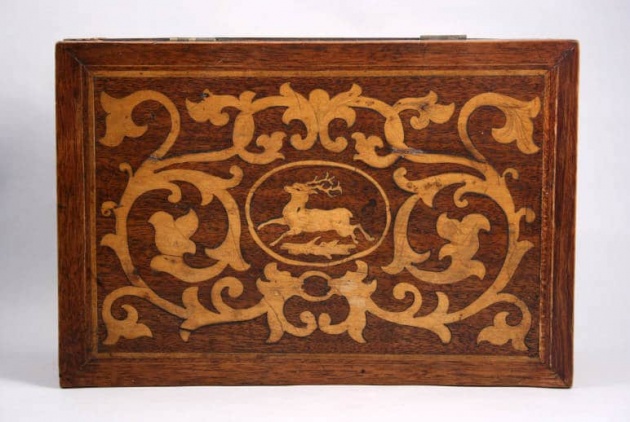 Inlaid box featuring an antlered deer, Menomonie, 1882. The majestic whitetail in the cartouche is a nine-point buck. Source: Wisconsin Decorative Arts Database.