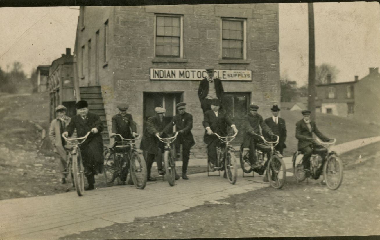 Riders in front of Indian Motorcycle shop, Shake Rag Street, Mineral Point