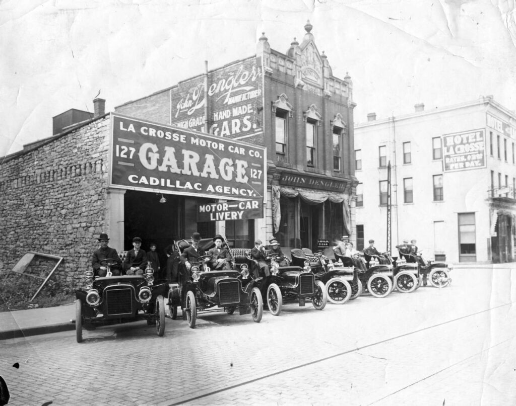 Image of automobiles lined up outside of the La Crosse Motor Car Company, Cadillac agency, ca. 1910. 100 block of 3rd Street North.