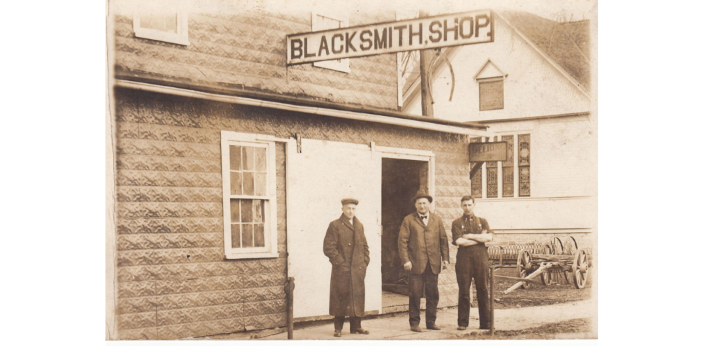 Men outside Fleischman's Blacksmith Shop, West Salem, circa 1920s