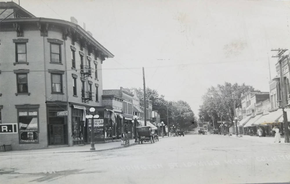 Ludington St. Looking West Postcard ca. 1920.