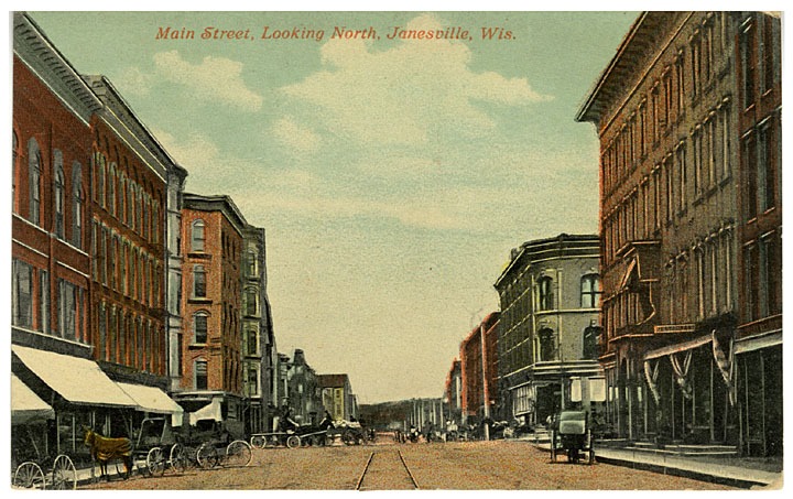 This description really paints a picture, "a subdued Main Street. No pedestrians are visible among the commercial buildings. Only horses and buggies parked along the street provide evidence that humans inhabit this town." 1911.