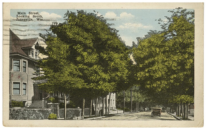 Main Street when it was a residential neighborhood with large leafy trees and large houses, 1918.