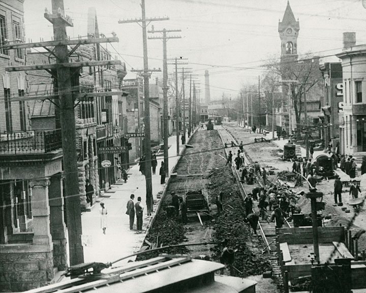 A view of Main Street looking west. This was the first cement street in Menasha, and all the cement was hand mixed. 1910.