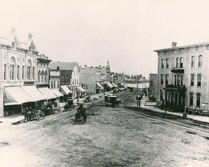 An undated view of Main Street looking east. The National Hotel is on the right. Also shown is a horse drawn streetcar.
