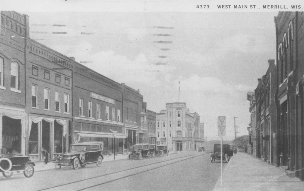 Looking east along the Merrill Street Railway's line through Merrill's West Side toward the Badger Hotel, 1925.