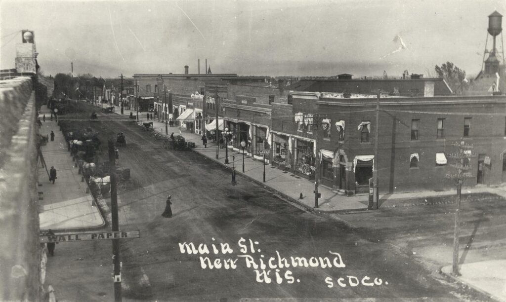 View of downtown New Richmond at the intersection of Third Street and Main Street, facing north, ca. 1900-1909.
