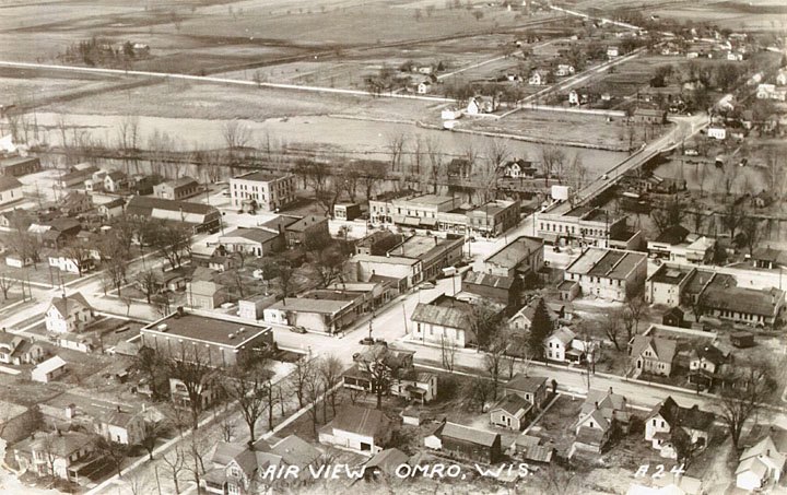 Aerial view of Omro, looking northwest towards Main Street and the Fox River. 1940.