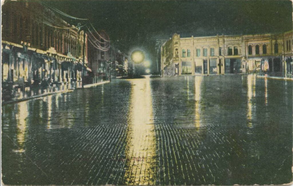 Watson Street facing south at night, ca. 1913.