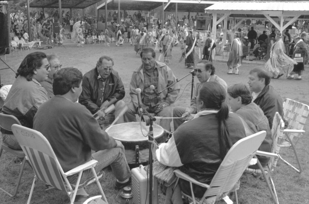 A Ho-Chunk drum performs for women dancers at the Labor Day Powwow in Black River Falls. 1994.