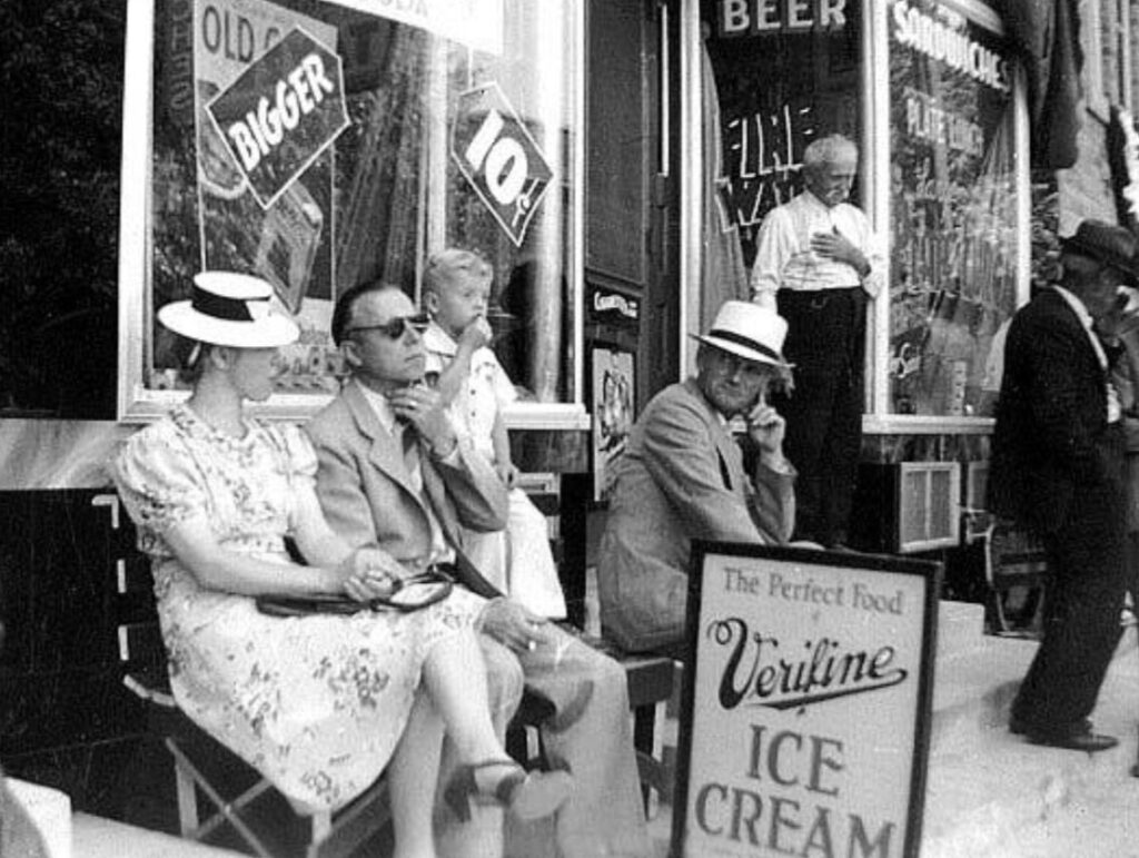 Customers sitting outside Grand View Cafe--Kewaskum, Wisconsin, 1940.