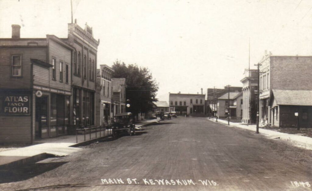 Street view of Main Street, Kewaskum, Wisconsin, ca. 1908-1926.