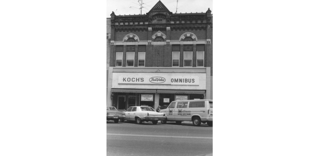 275 Main St, Reedsburg, Sauk County, Wisconsin, 1983-84. This commercial vernacular structure was built by Reedsburg Building and Lumber in 1885 for Joseph L. Green. He leased it to Gale, Siefert and Company Hardware for five years. August Siefert was in the hardware business in Reedsburg for several years with various partners. The building has housed a number of businesses over the years and is a part of the Main Street Commercial Historic District. At the time of the survey. Kathy's music occupied the building. As of early 2024, this building is occupied by U.S. Cellular and Hometown Fashions.