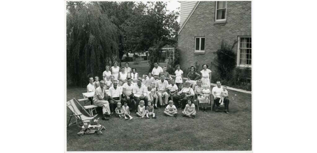 South Milwaukee Block Party Group Photograph, 1957. Families pose during a block party on the 400 block of Menomonee Avenue.