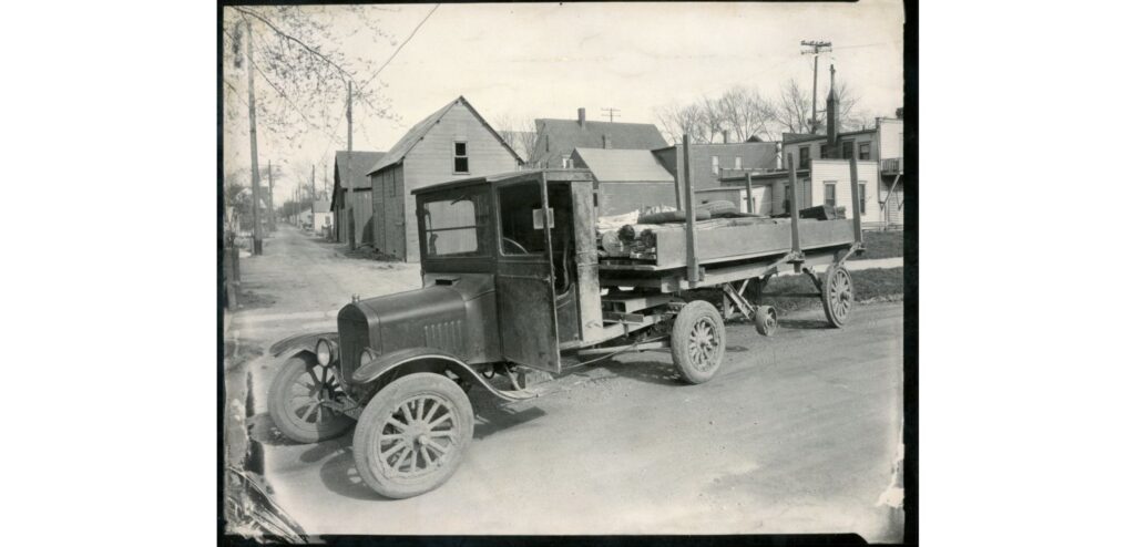 A working Ford Model A pickup truck (1927), hauling material on an unidentified South Milwaukee street.