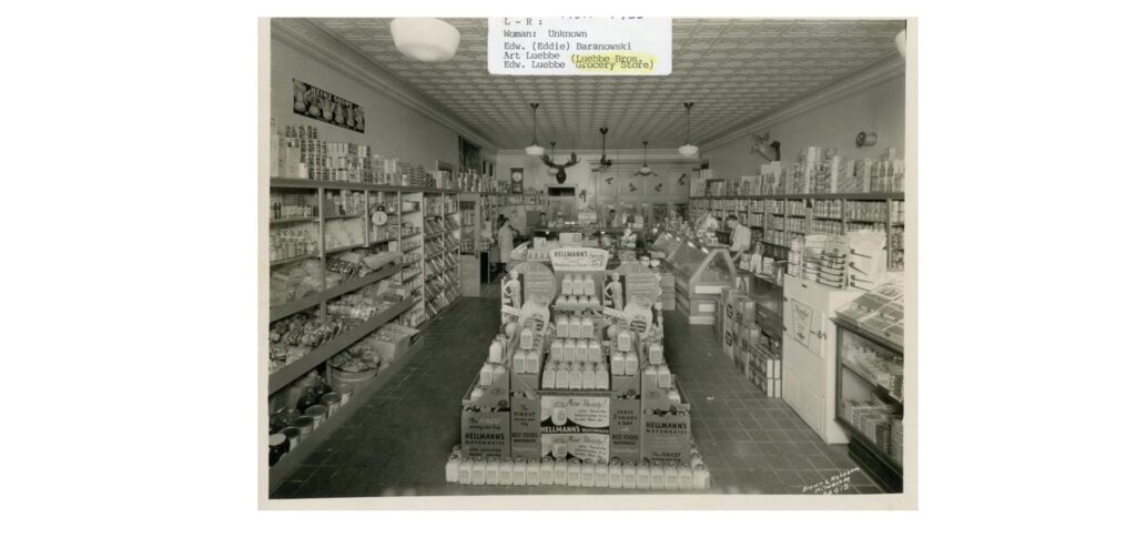 Luebbe Grocery Store (1927), 901 Milwaukee Avenue. Pictured are Unknown, Eddie Baranowki, Art Luebbe, Edward Luebbe.